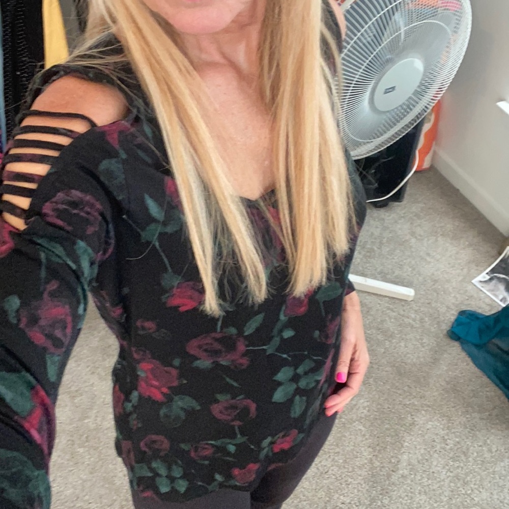 Long sleeve dark floral top with sleeve cutouts